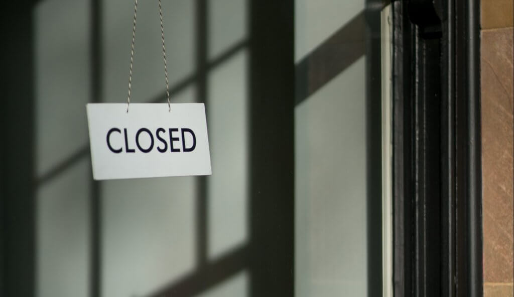 white closed hanging signage